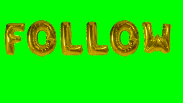 Ordet Följ från helium guld ballong bokstäver flyter på grön skärm — Stockvideo