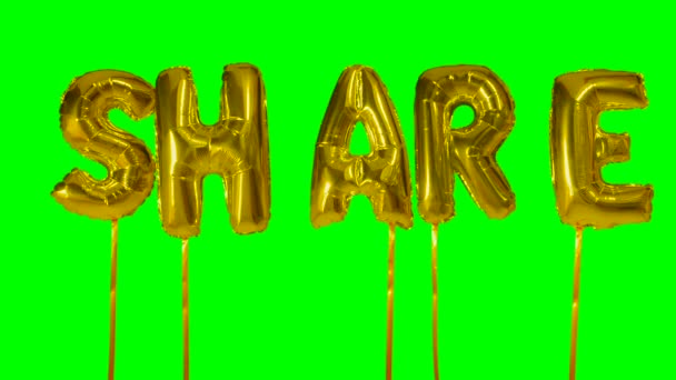 녹색 화면에 떠 있는 황금 헬륨 풍선 편지에서 단어 공유 — 비디오
