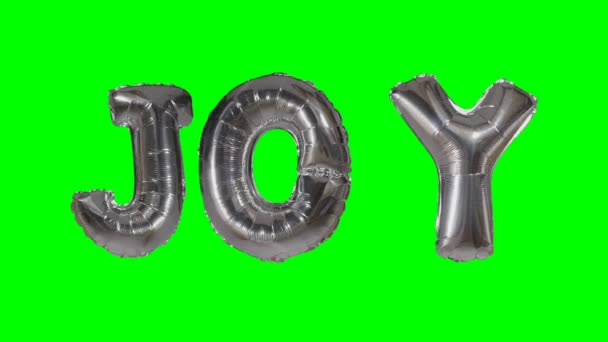 Λέξη χαρά από ήλιο ασημένια γράμματα μπαλόνι επιπλέει στην πράσινη οθόνη — Αρχείο Βίντεο