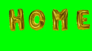 Sözcük yeşil ekran üzerinde yüzen altın helyum balon harfler evden