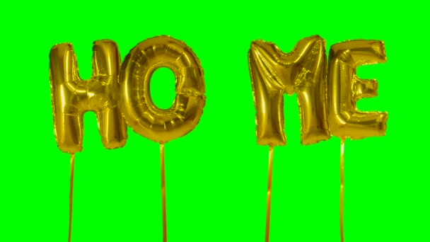 Sözcük yeşil ekran üzerinde yüzen altın helyum balon harfler evden — Stok video