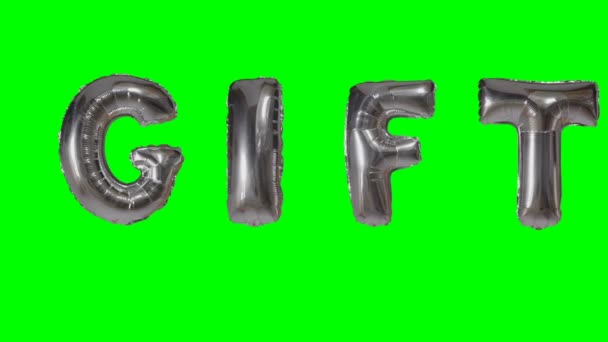 Word geschenk van zilver helium ballon brieven drijvend op groen scherm — Stockvideo