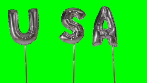 Palavra EUA de letras de balão de prata de hélio flutuando na tela verde — Vídeo de Stock