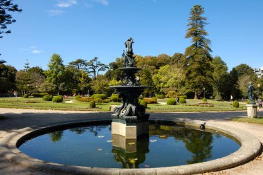 Porto, Portugal - October 6, 2018 : Fountain in the famous Crystal Palace garden, Porto, Portugal clipart