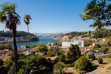 Porto, Portugal - October 6, 2018 : From the gardens of the Crystal Palace a magnificent view of the river Douro and its banks, Porto, Portugal clipart
