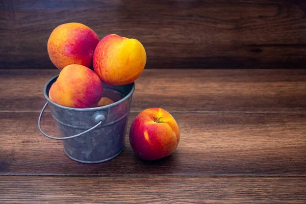 Peaches Bucket Wooden Background Copy Space — Stock Photo, Image