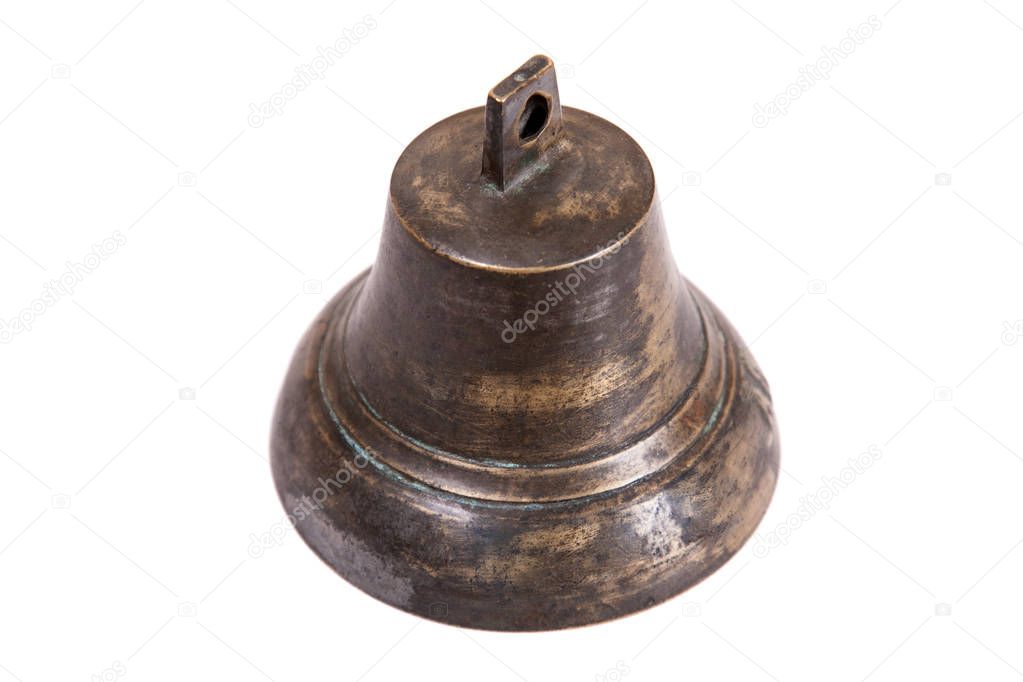 Ancient bell on a white background close-up.