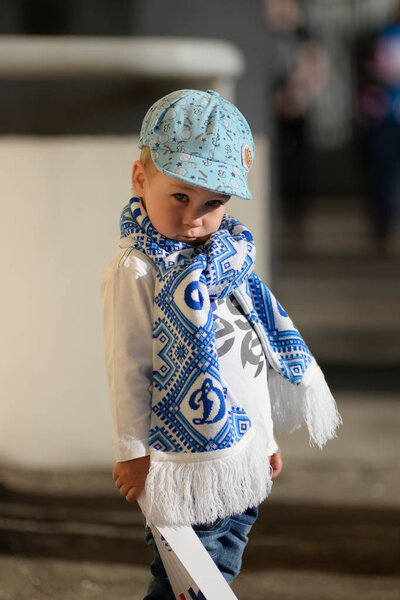 MINSK, BELARUS - MAY 23, 2018: Little fans looks before the Belarusian Premier League football match between FC Dynamo Minsk and FC Bate at the Tractor stadium.