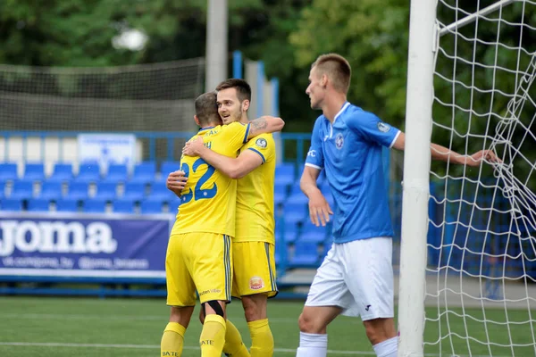 MINSK, BELARUS - JUNE 29, 2018: Soccer players celebrate goal during the Belarusian Premier League football match between FC Luch and FC BATE at the Olimpiyskiy stadium. — Stock Photo, Image