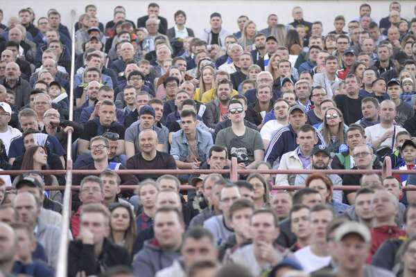 MINSK, BELARUS - MAY 23, 2018: Fans looks game during the Belarusian Premier League football match between FC Dynamo Minsk and FC Bate at the Tractor stadium.