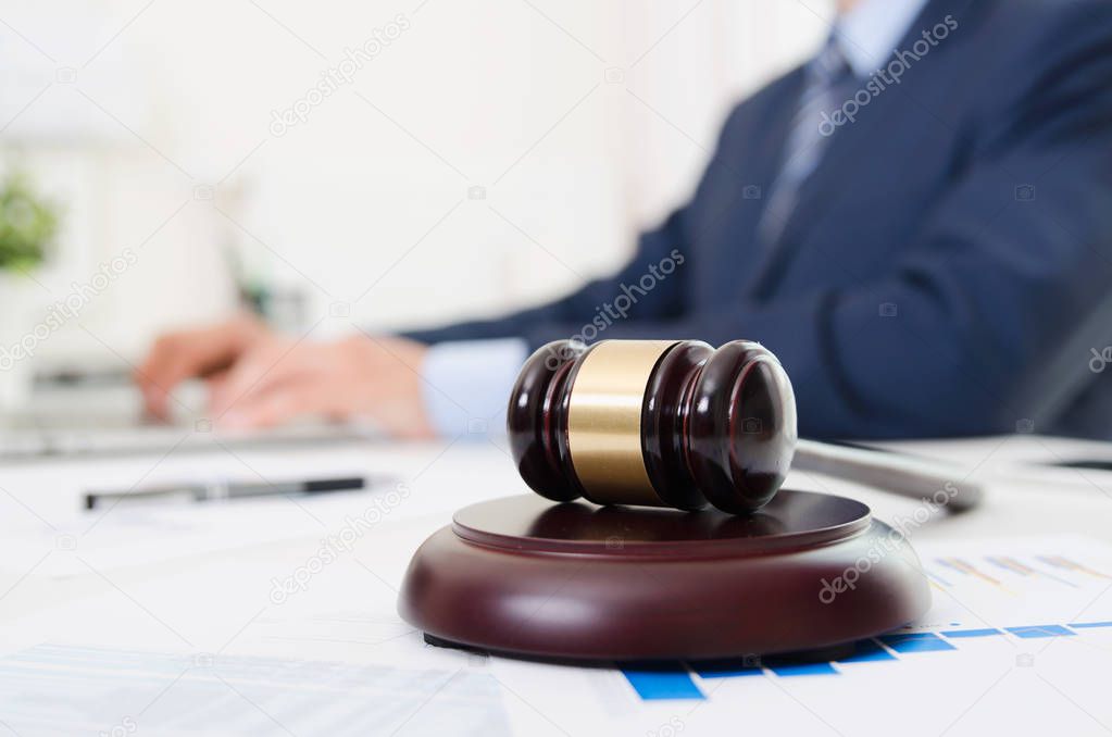 Wooden gavel on table. Attorney working in office. Law attorney court judge justice gavel legal legislation concept