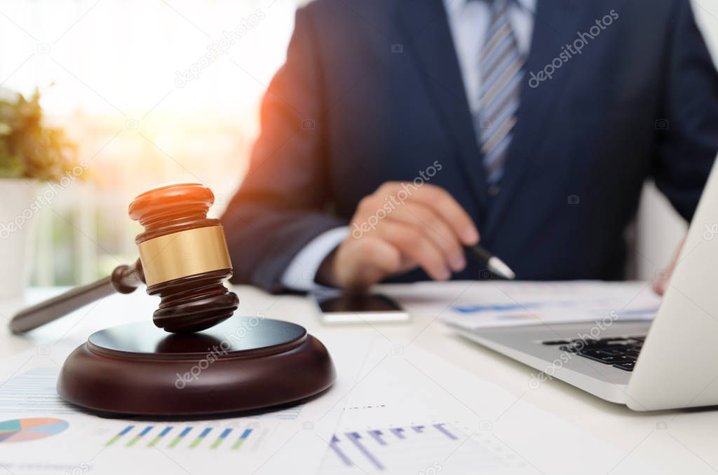 Justice symbol wooden gavel on table. Attorney working in office. Law attorney court judge justice legal legislation concept