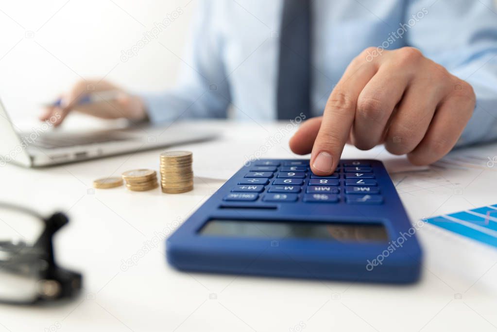 Man calculates the savings. Budget planning concept. Businessman working in the office
