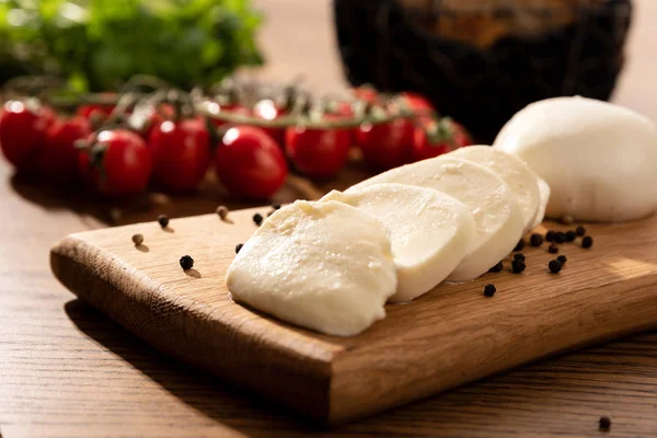 Mozzarella cheese on wooden board. Italian food.