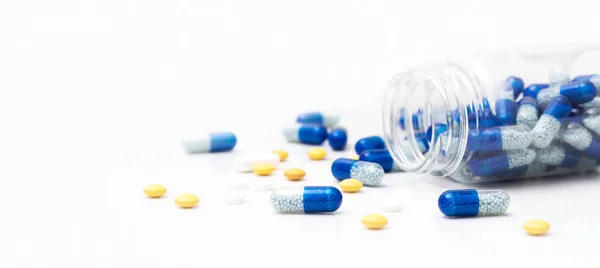 Pile of spilled capsules on a white background — Stock Photo, Image