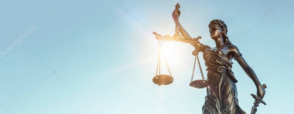 Lady justice. Statue of Justice on sky background