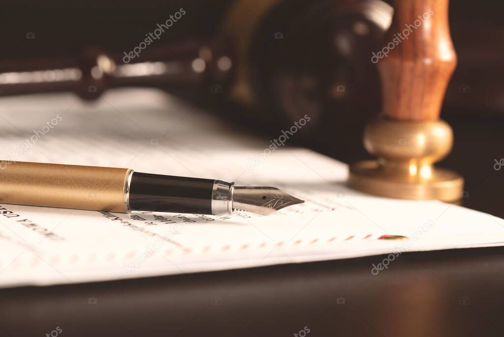 Law, notary background theme. Fountain pen and handmade paper on desk