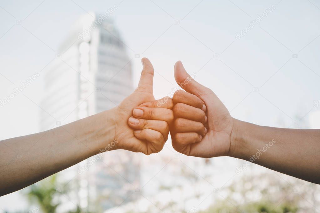 Hand of men giving Thumb finger like action after agreement