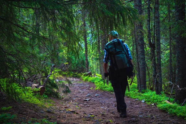 One guy goes up in the mountains Stock Photo