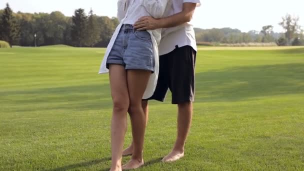 Happy Couple Standing Grass Hugging Weekend Park Outdoors Steadycam Shot — Stock Video