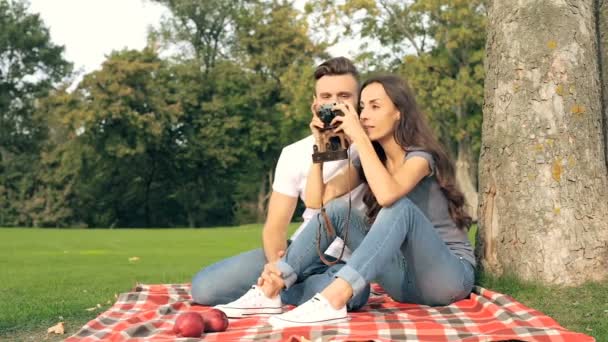 Young Couple Sitting Plaid Tree Taking Photos Old Camera — Stock Video