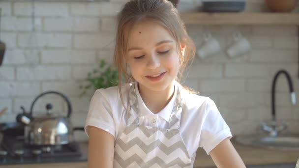 Portrait Smiling Kid Girl Looking Camera Indoors Kitchen Slowmotion — Stock Video