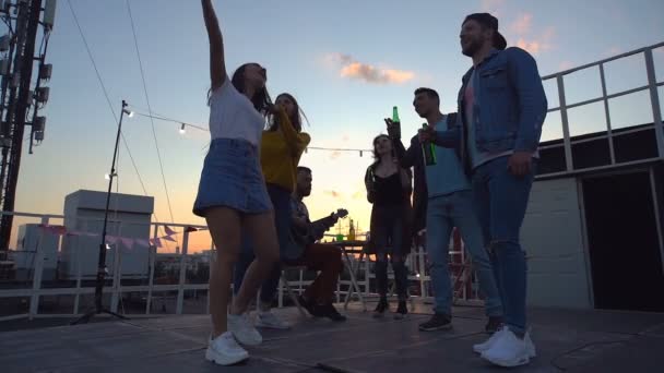 Friends Standing Rooftop Talking Clinking Beer Bottles Rooftop Party — Stock Video
