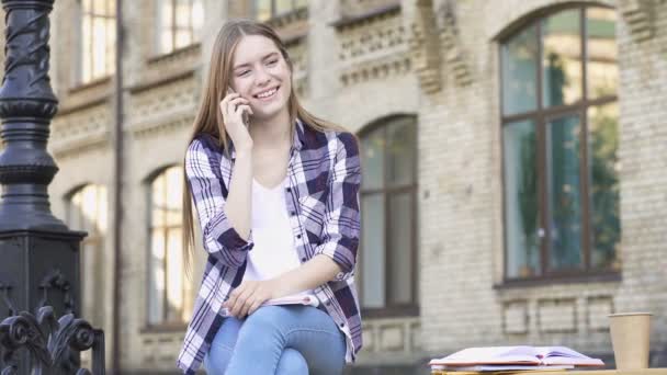 Young Woman Sitting Bench Smiling Talking Smartphone — Stock Video