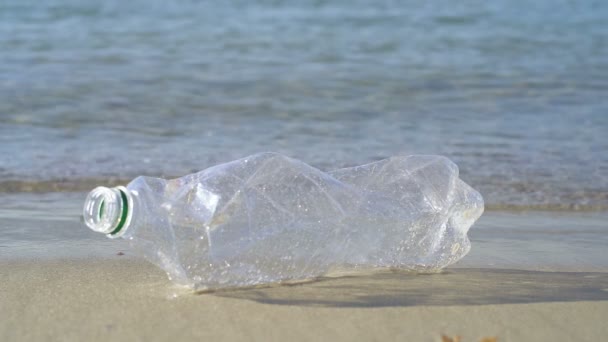 Plastic Bottle Lies Sand Sea Slowmotion — Stock Video