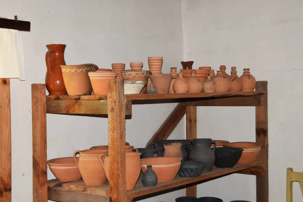 clay pots and dishes made in an old cottage in the Middle Ages