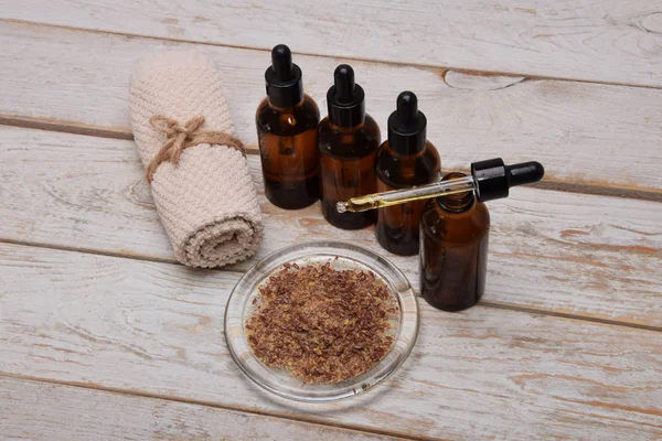 face oils with a dropper and seeds to make a home facial mask