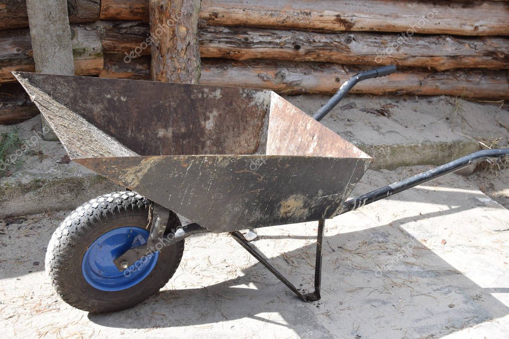 mortar cement on a metal wheelbarrow prepared for bricklaying