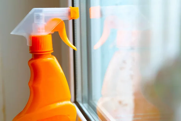 window cleaner on the window sill