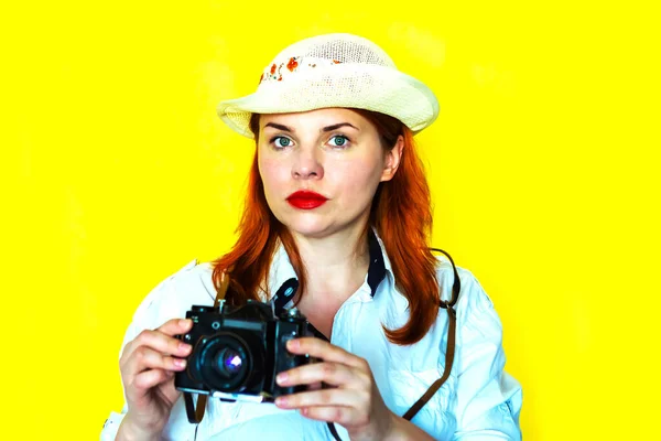 Young woman with vintage camera. Travel concept
