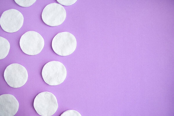 Cotton sponges pattern on purple background, minimal concept, copy space
