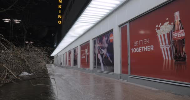 Cinema with Coca Cola and popcorn banners, night view — Stock Video