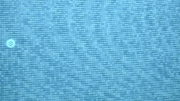 View to mosaic tiled bottom of swimming pool through clear water — Stock Video