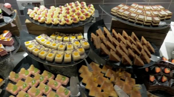 Buffet table with desserts in hotel — Stock Video