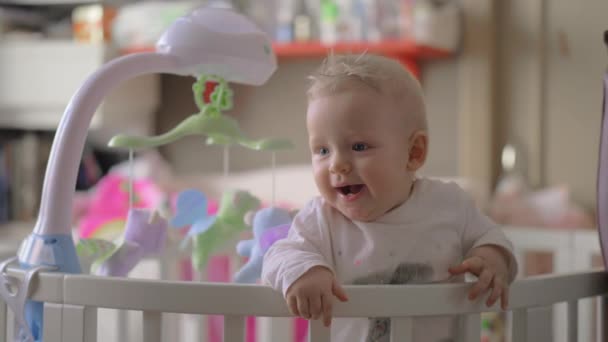 Cute baby girl playing in a round crib 5 — Stock Video