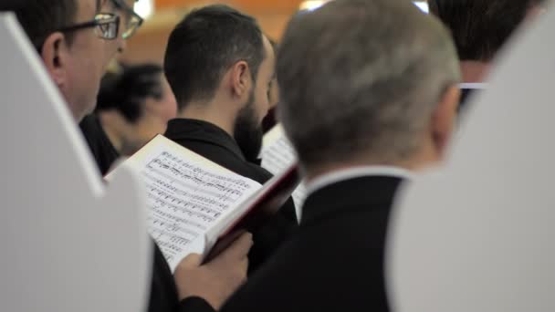 Choir singers with musical score — Stock Video