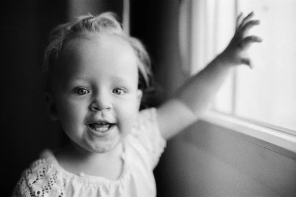 Portrait of happy one year old girl in black and white — Stock Photo, Image