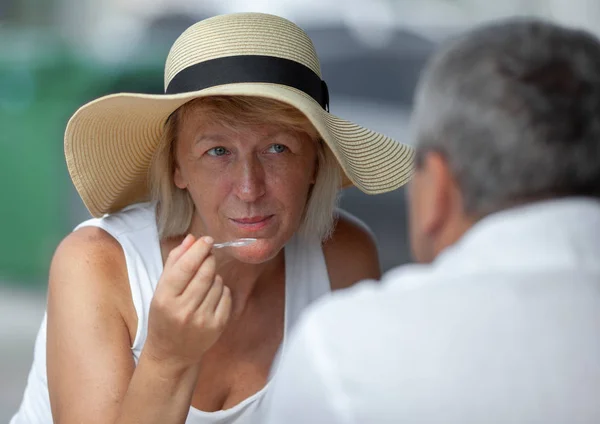 Mature woman in outside cafe — Stock Photo, Image