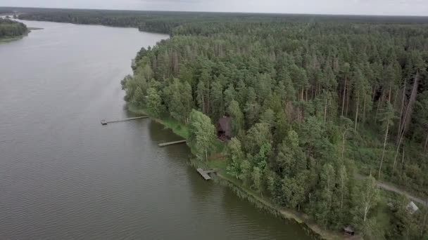 Aerial view of leisure base in the wood on river bank — Stock Video