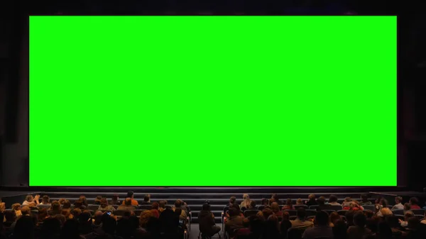 People in the auditorium with chroma key screen — Stock Photo, Image