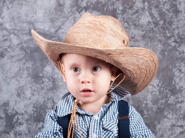 Little kid in cowboy hat Stock Image