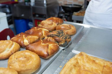 Freshly baked goods displayed on a tray at a local bakery.