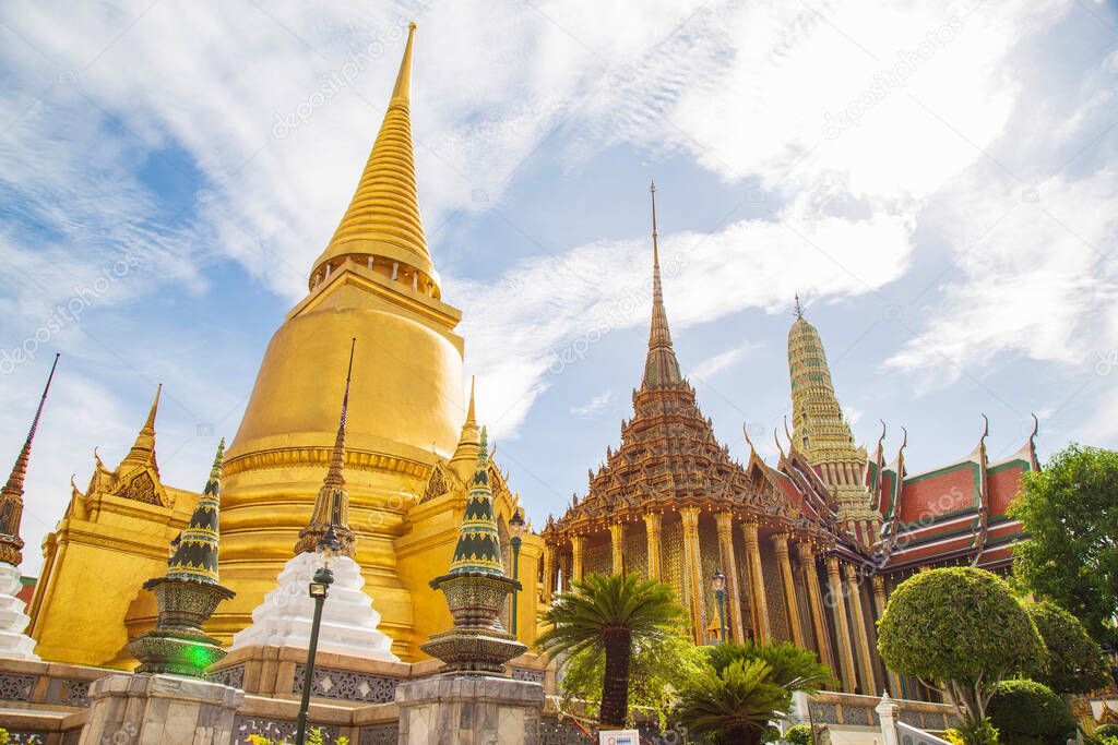 The beautiful inside of the Emerald Buddha Temple and the Grand Palace with The great pagoda and church against the sky, This is an important Buddhist temple and a famous tourist destination of Bangkok, Thailand 