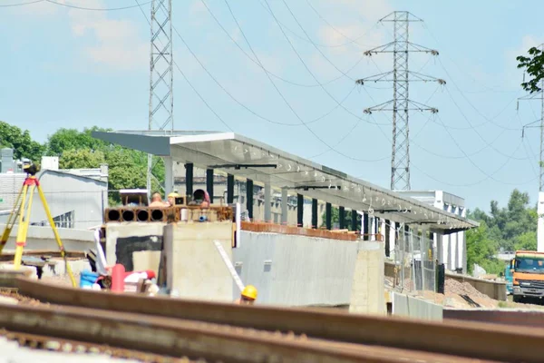 Railway Workers repairing railway on hot summer day