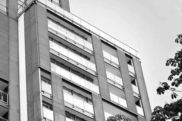 Modern apartment building exterior. Black and white.