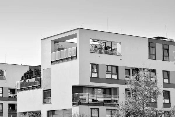 Modern apartment building exterior. Black and white.